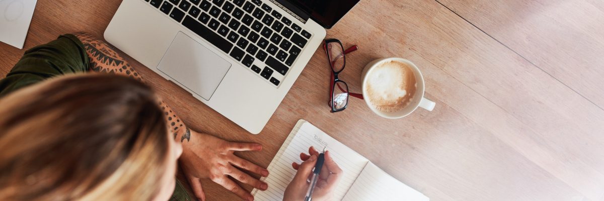Woman making to do list on diary